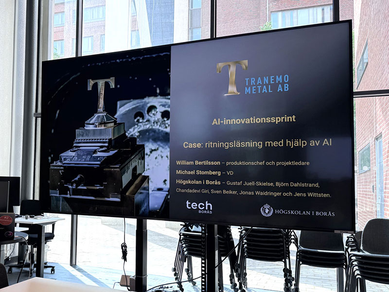 Storbildsskärm med presentation om AI